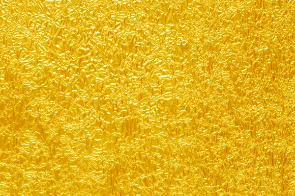Parlak sarı yaprak altın folyo dokusu arka plan