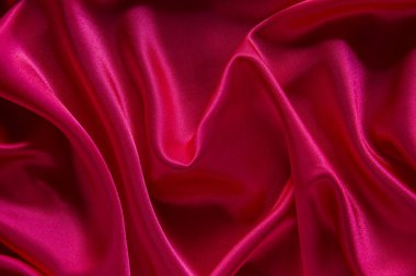 Kırmızı bez dalga arkaplan dokusu.