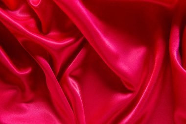 Kırmızı bez dalga arkaplan dokusu.