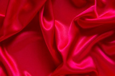 Kırmızı bez dalga arkaplan dokusu.