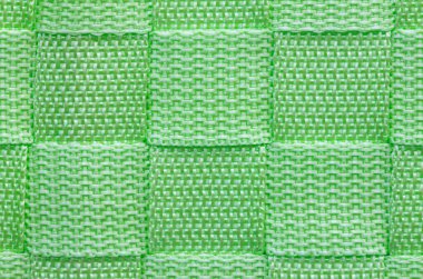 Arka planda yeşil örgü ipi var..