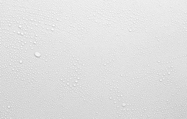 Beyaz yüzeyde arkaplan olarak su damlası