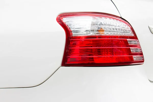 red led taillight on white car