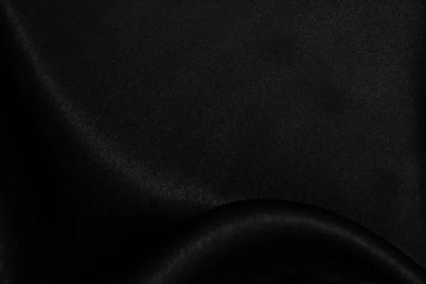 光滑典雅的黑色丝绸或缎子质感可用作抽象的背景 — 图库照片