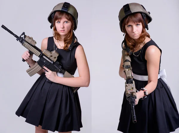 Chica divertida con rifle muestra muecas — Foto de Stock