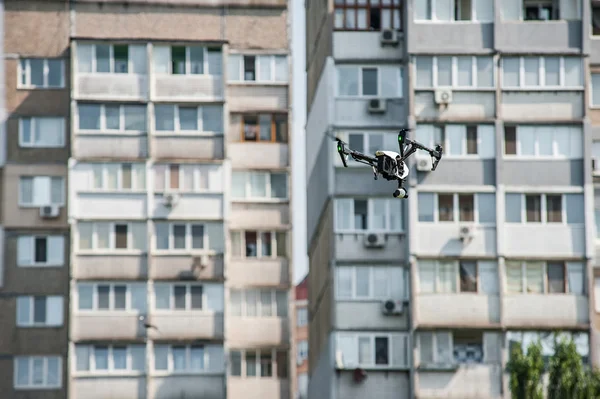 Drone flies near building