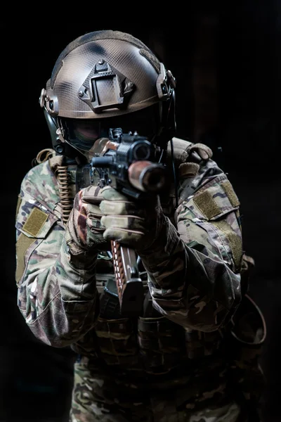 Russian army soldiers in a mask shoots a machine gun — Stock Photo, Image