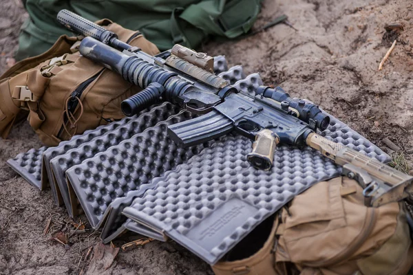 Sniper reload his rifle in forest Stock Photo by ©Nesterenko_Max 89103288