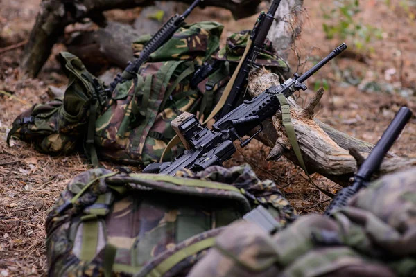 A Camouflaged Sniper Sitting In The Woods Aiming Through His Scope Stock  Photo, Picture and Royalty Free Image. Image 42659284.