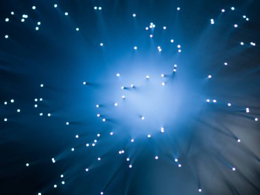 Işıklandırılmış fiber optik iplikler çözünmüş arka planda. soyut duvar kağıdı