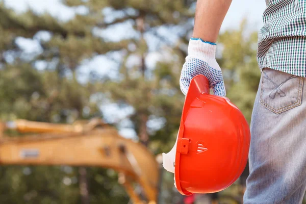 Closeup Engineer Holding Orange Helmet Construction Site Outdoors Royalty Free Stock Images