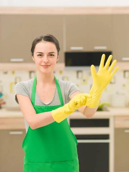 Happy Housewife Putting Rubber Gloves Home Kitchen Background — Stock Photo, Image