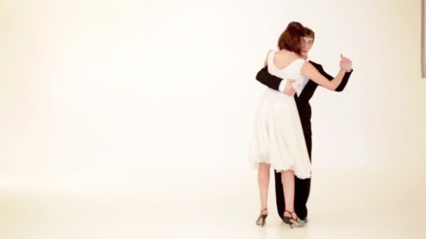 Young Couple Showing Tango Moves White Background — Stock Video