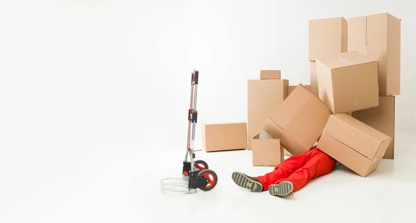 Delivery Man Laying Floor Covered Cardboard Boxes — Stock Photo, Image