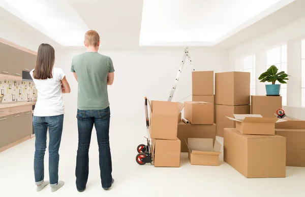 Rear View Couple Standing New Apartment Pile Cardboard Boxes Them — Stock Photo, Image