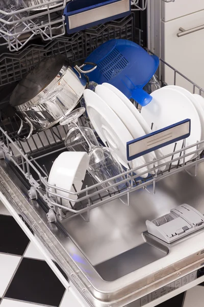 Dishwasher loades in a kitchen with clean dishes — Stock Photo, Image