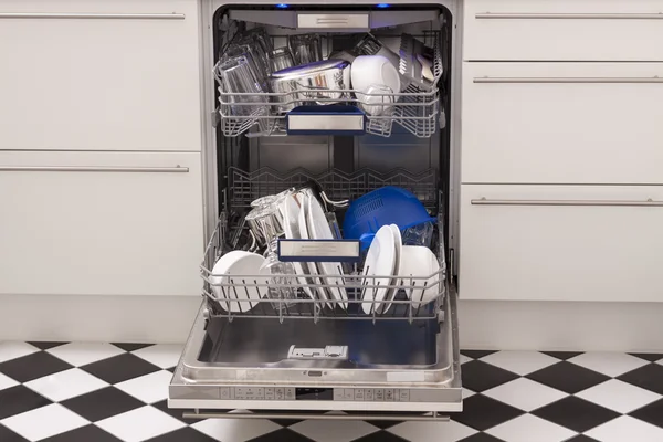 Dishwasher loades in a kitchen with clean dishes — Stock Photo, Image