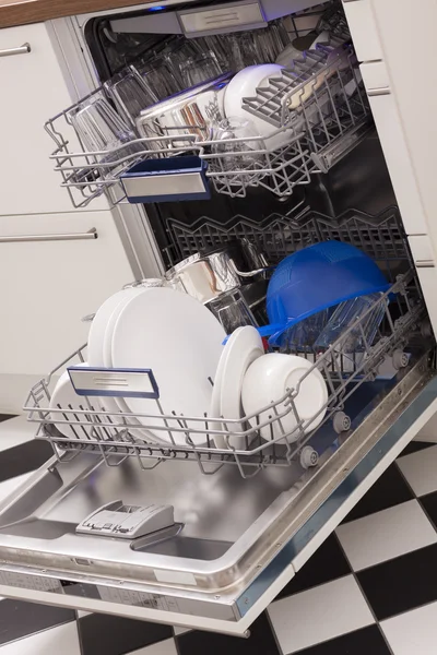 Dishwasher loades in a kitchen with clean dishes — Stock Photo, Image