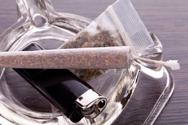 Close up of marijuana and smoking paraphernalia Royalty Free Stock Photos