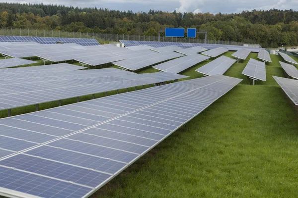 Field with blue siliciom solar cells alternative energy Royalty Free Stock Photos