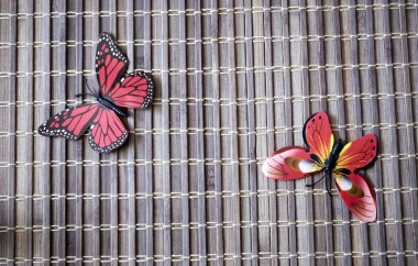 Bambu hasırından yapılmış kelebeklerin yaratıcılığı için arka plan