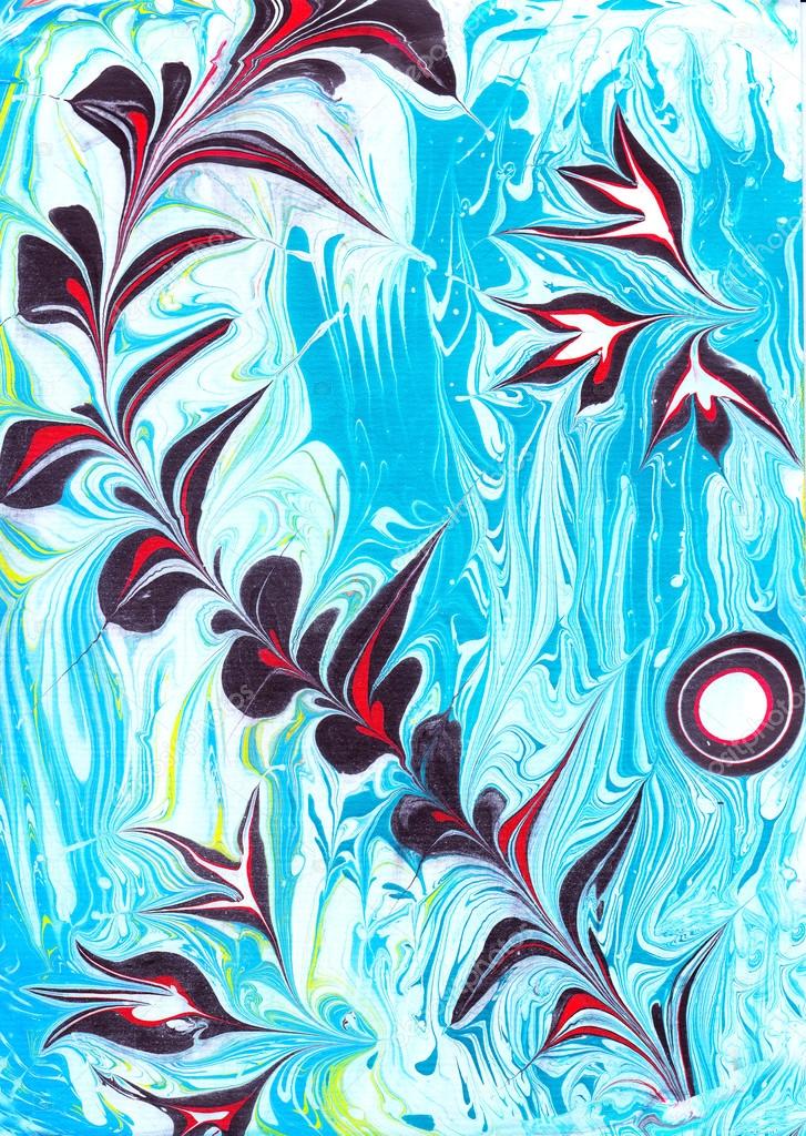Traditional Turkish Ebru paint technique. painting on water, followed by paper prints. Colorful branch on the blue background