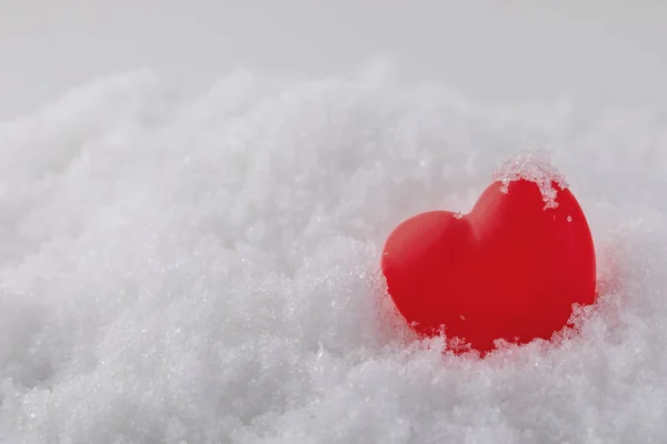 Volumetric red heart in white snow, concept of love and romance, background for valentines day — Stock Photo, Image