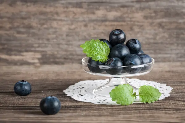 Fresh blueberries in a glass vase — Stock Photo, Image