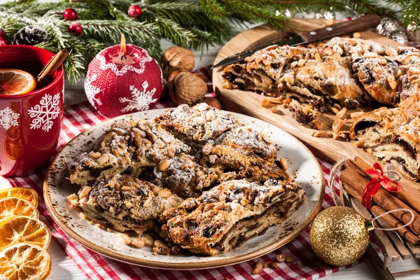 Christmas sliced cake on holiday table — Stock Photo, Image