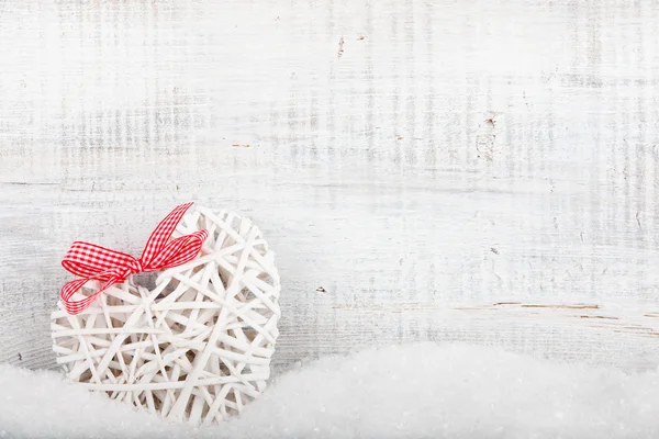 Decorative heart on snow — Stock Photo, Image