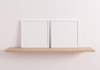 Double 10x10 Square White Frame mockup on wooden shelf and white wall. Two empty poster frame mockup on wooden shelf and white background. 3D Rendering