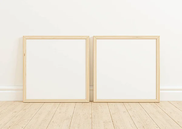 Double 10x10 Square Wooden Frame mockup on wooden floor and white wall. Two empty poster frame mockup on wooden floor and white background. 3D Rendering