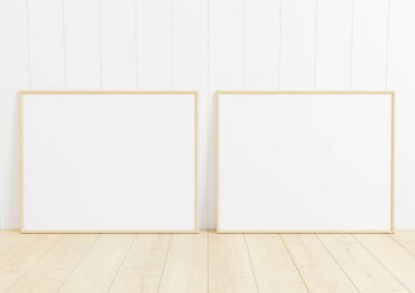 Çifte 8x10 Yatay Ahşap Çerçeve modeli ahşap zemin ve beyaz ahşap duvar. Ahşap zeminde iki boş poster modeli ve beyaz ahşap arka plan. 3B Hazırlama