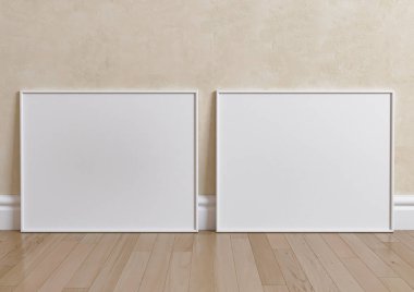 Ahşap zeminde ve bej duvarda çift 8x10 Yatay Beyaz Çerçeve modeli. Ahşap zemin ve bej arka planda iki boş poster modeli. 3B Hazırlama