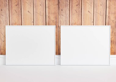 Çift 8x10 Yatay Beyaz Çerçeve modeli beyaz zeminde ve kırsal ahşap duvarda. Beyaz zeminde ve ahşap arka planda iki boş poster modeli. 3B Hazırlama