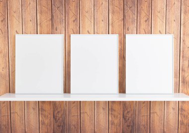 Üçlü 8x10 dikey beyaz çerçeve modeli beyaz raf ve kırsal ahşap duvar. Beyaz raf ve ahşap arka planda üç boş poster modeli. 3B Hazırlama