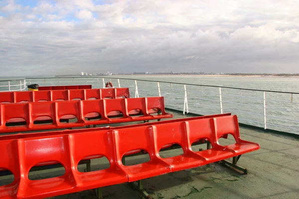 Passenger deck with railing aboard the ferry between France and England with seats and viewing points
