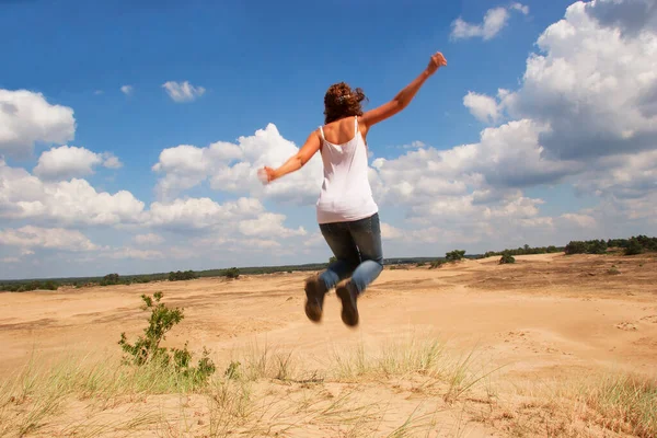 Woman Jumping Dirty Road Desert — стоковое фото