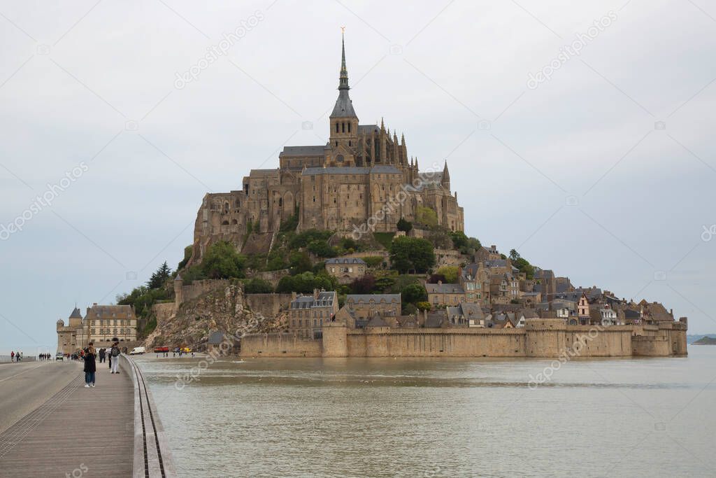 Le Mont-Saint-Michel is a tidal island and mainland commune and big castle in Normandy, France