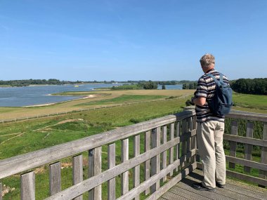 tourist looking at the river