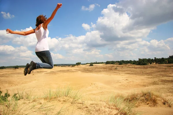 Woman Jumping Dirty Road Desert — стоковое фото