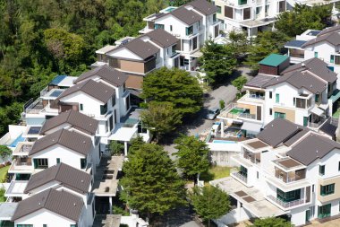 Above view of a semi detached housing neighborhood development located in Batu Ferringhi on Penang Island in Malaysia. clipart