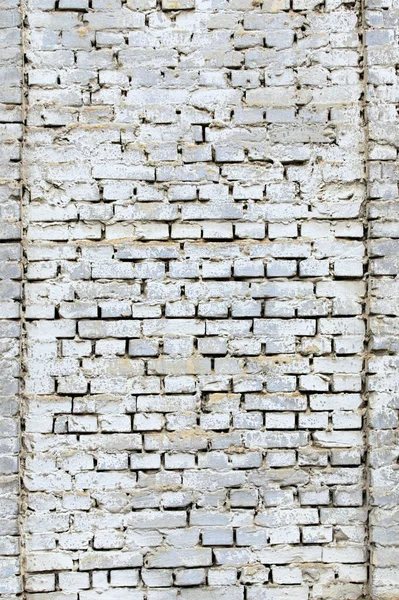 Background of white brick wall texture. Close-up view of cement bonded brick wall. An ancient white brick wall. Texture background. White vintage stone wall, texture background. Stone texture.