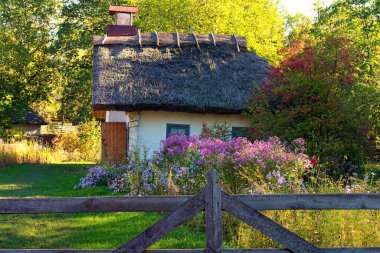 Pereyaslav, Ukraine-October 14, 2020:Reconstruction of an ancient clay house of widow woman with front yard. The sights and history of Ukraine. Concept of historical buildings in ancient Ukraine.