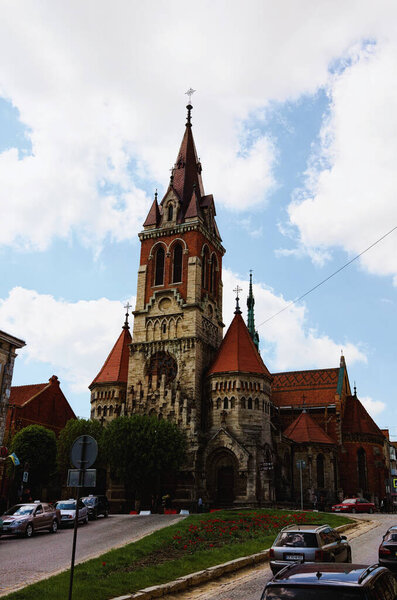 Chortkiv, Ukraine-May 12, 2021:Scenic landscape view of medieval gothic Saint Stanislaus Cathedral. Blue sky background. Built in the early XVII century. Rebuilt in the early twentieth century.