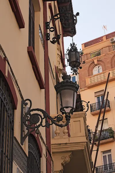 Two antique street lamps are hanging on the house — Stock Photo, Image