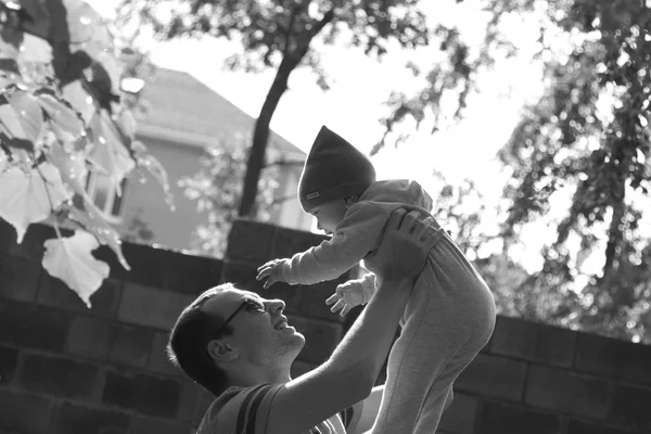 Dad and son playing on the walk