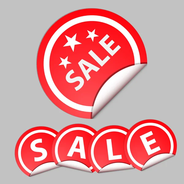 Red sticker with the text of sale. grey background — Stock Photo, Image