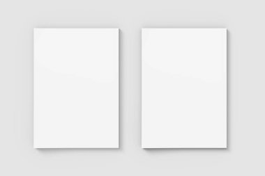 Gri arkaplanda iki boş a4 boyutunda kağıt modeli, boş kağıt maketi
