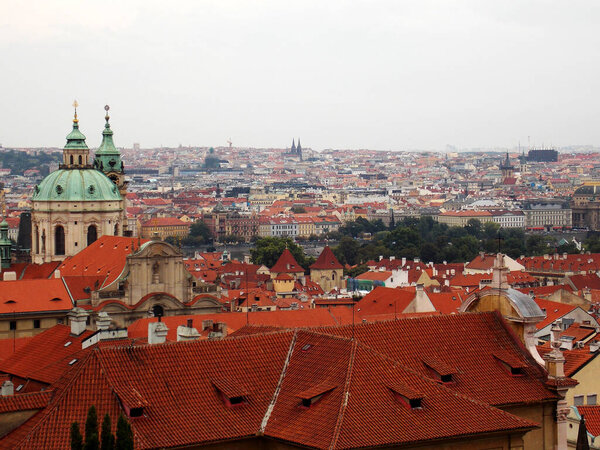 View of the red ruins of the historic center of Prague on a cloudy day